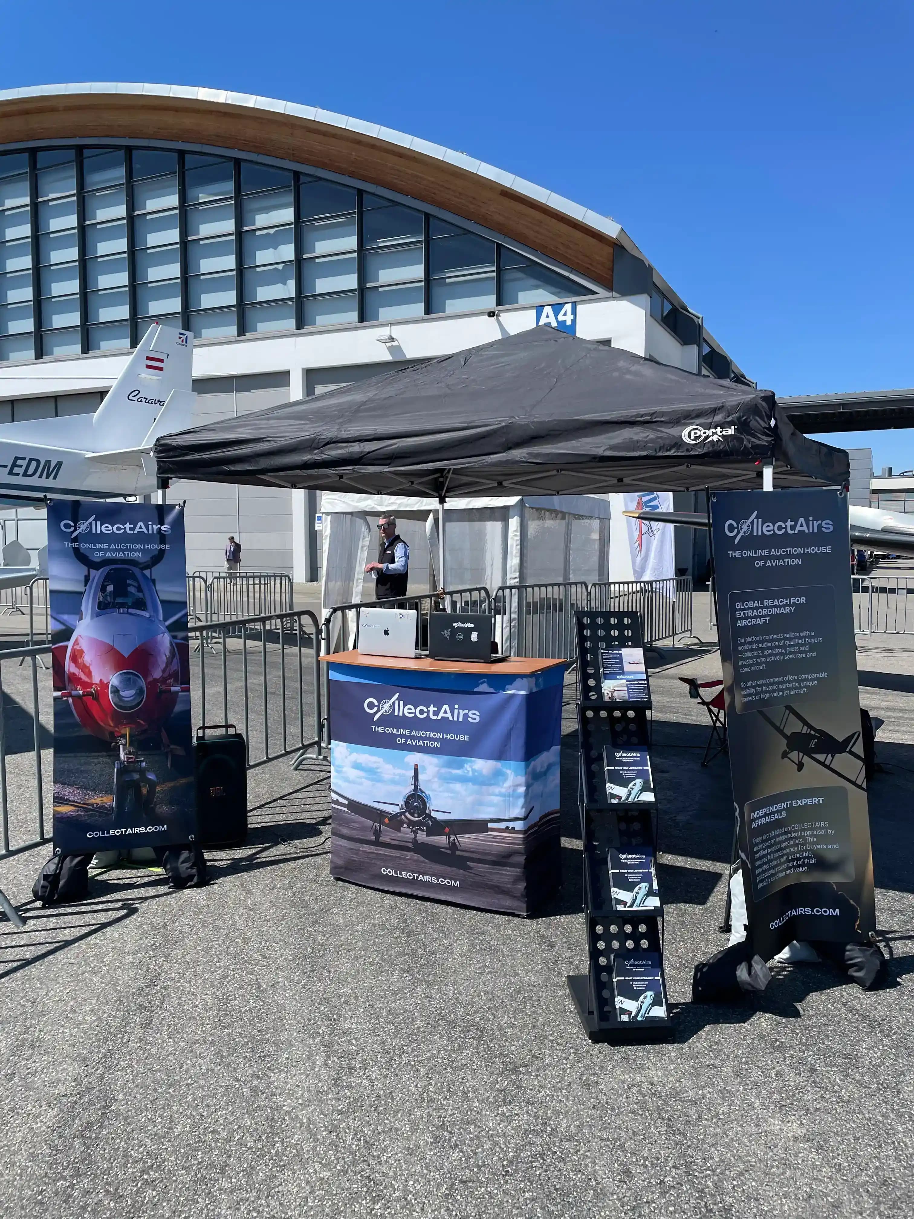 CollectAirs exhibition booth at AERO Friedrichshafen 2026 with branded banners and counter
