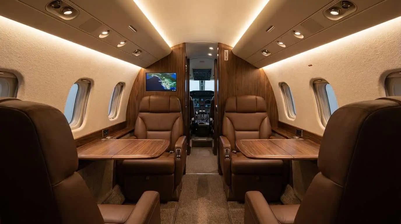 Beechcraft King Air cabin interior showing executive seating configuration with leather seats and fold-out tables