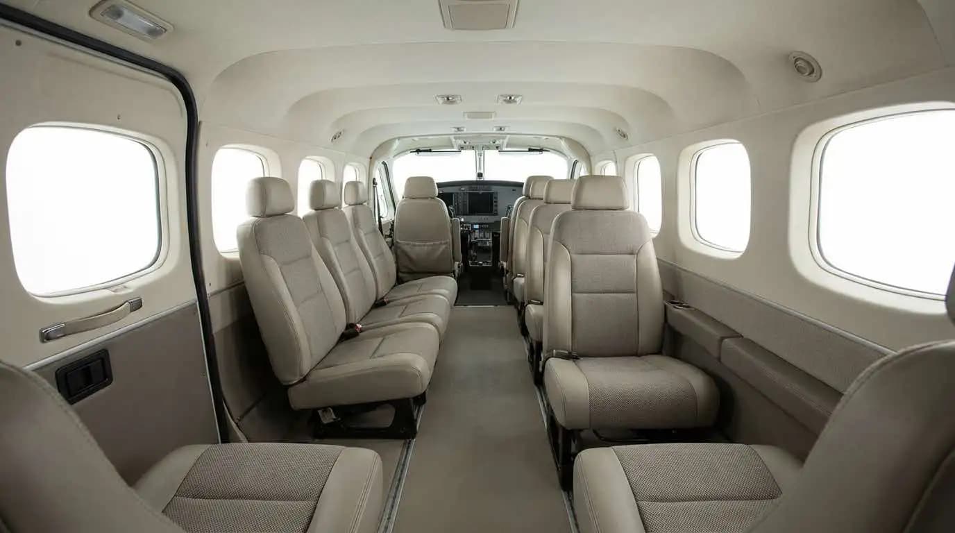 Cessna Grand Caravan EX cabin interior showing forward-facing passenger seating configuration and large cargo door