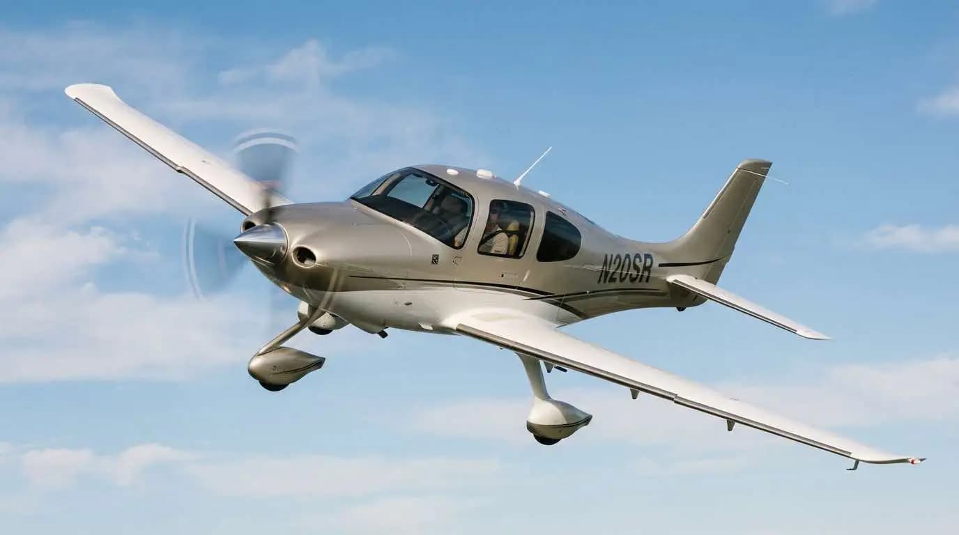 Cirrus SR20 in flight showing sleek composite design and inherent aerodynamic efficiency